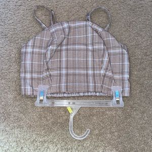 This is a brown light brown and blue, striped spaghetti strap crop top